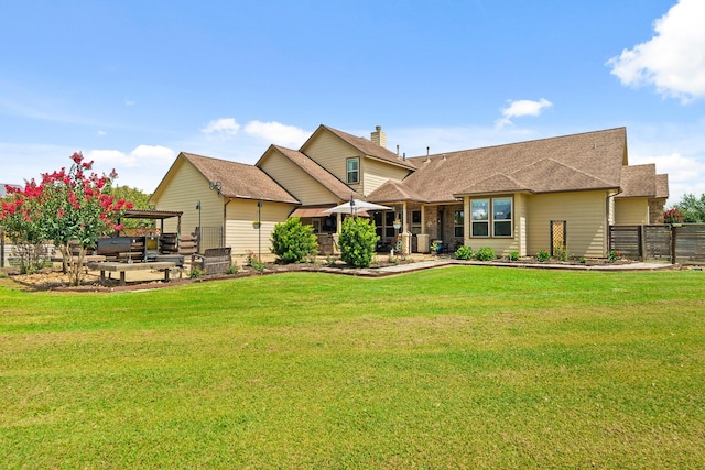 4419 Lea Ln, Fulshear, TX 77406 - back of house with a patio, roof with shingles, and a chimney