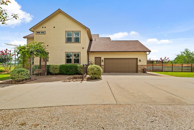 4419 Lea Ln, Fulshear, TX 77406 - view of property exterior with concrete driveway, a garage, brick siding, and roof with shingles