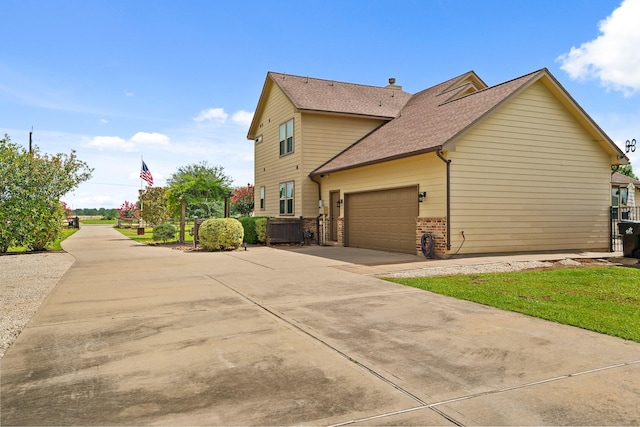 4419 Lea Ln, Fulshear, TX 77406 - view of property exterior with brick siding, a garage, a shingled roof, and driveway