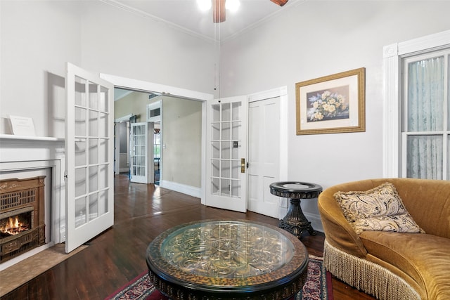 250 N Main St, Jasper, TX 75951 - living area with french doors, wood finished floors, crown molding, ceiling fan, and a high ceiling