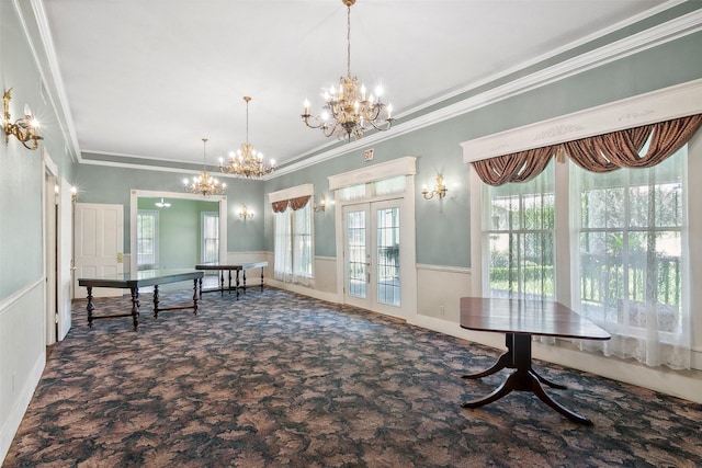 250 N Main St, Jasper, TX 75951 - carpeted dining space with a chandelier, french doors, crown molding, and a wainscoted wall