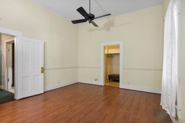 250 N Main St, Jasper, TX 75951 - unfurnished bedroom featuring ornamental molding, wood finished floors, a spacious closet, and ceiling fan