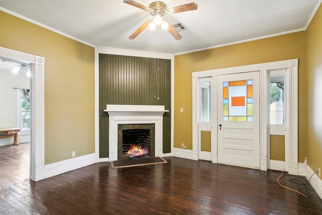 250 N Main St, Jasper, TX 75951 - unfurnished living room featuring hardwood / wood-style floors, ceiling fan, crown molding, and a lit fireplace