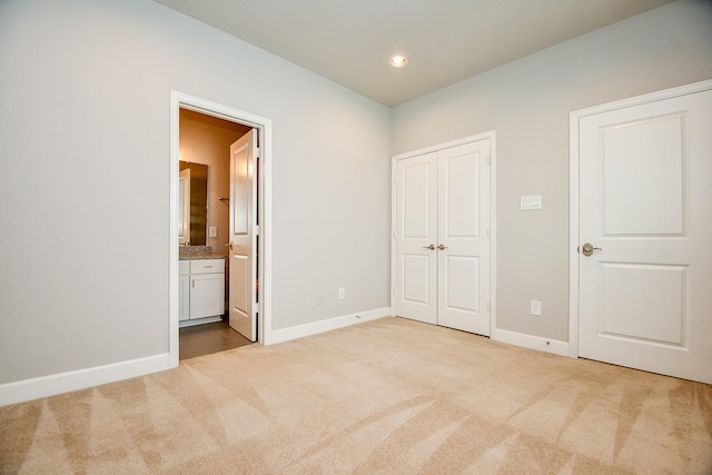 1909 Hickory St, Houston, TX 77007 - unfurnished bedroom with carpet flooring, a closet, ensuite bath, and recessed lighting