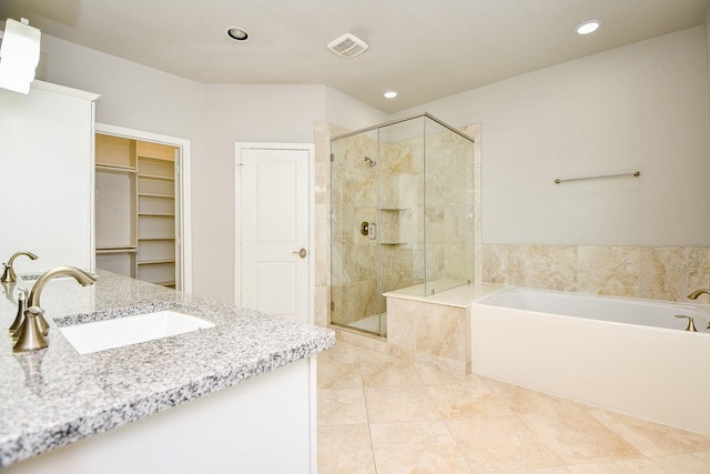 1909 Hickory St, Houston, TX 77007 - full bathroom with a shower stall, recessed lighting, a bath, vanity, and a walk in closet