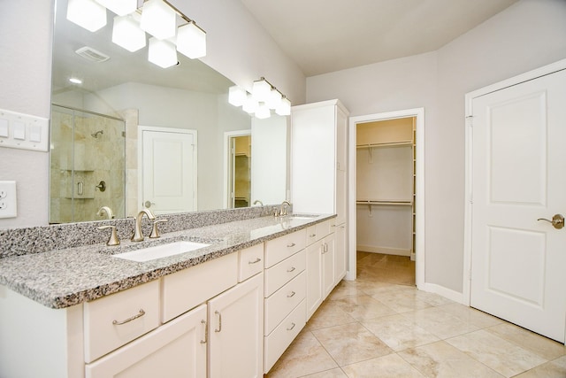 1909 Hickory St, Houston, TX 77007 - full bath featuring a stall shower, double vanity, and a spacious closet