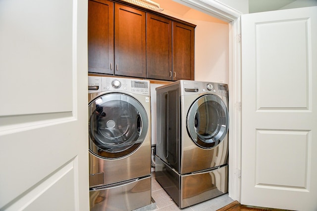 1909 Hickory St, Houston, TX 77007 - laundry area with cabinet space and washer and dryer