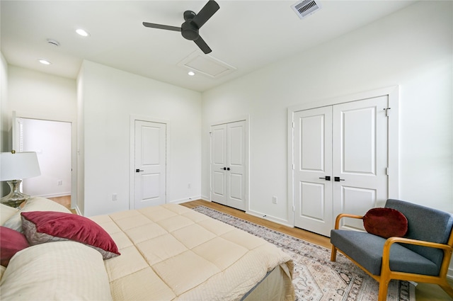 4009 New Orleans St A/B, Unit A/B Houston, TX 77020 - bedroom featuring multiple closets, attic access, wood finished floors, recessed lighting, and a ceiling fan