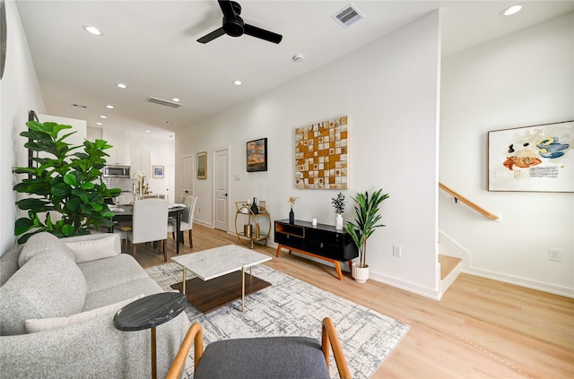 4009 New Orleans St A/B, Unit A/B Houston, TX 77020 - living room with stairs, light wood-style flooring, recessed lighting, and a ceiling fan