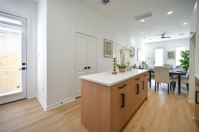 4009 New Orleans St A/B, Unit A/B Houston, TX 77020 - kitchen with light wood-style floors, a center island, healthy amount of natural light, light countertops, and recessed lighting