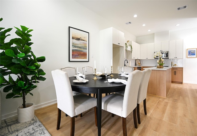 4009 New Orleans St A/B, Unit A/B Houston, TX 77020 - dining space with light wood-style floors and recessed lighting