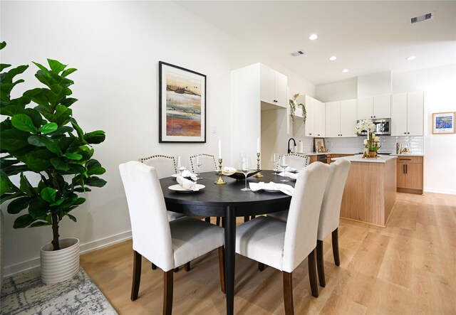 4009 New Orleans St A/B, Unit A/B Houston, TX 77020 - dining room with light wood-style flooring and recessed lighting