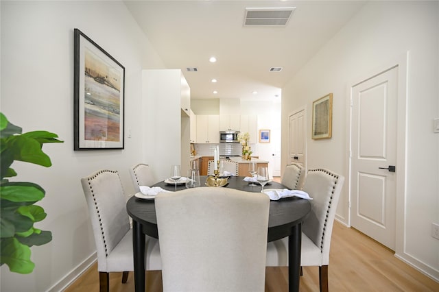 4009 New Orleans St A/B, Unit A/B Houston, TX 77020 - dining space featuring light wood-type flooring and recessed lighting