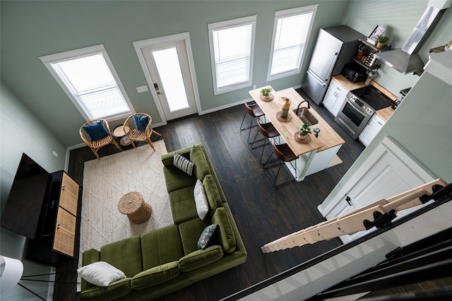 1084 Johnson Rd, Gilchrist, TX 77617 - living area featuring dark wood finished floors and baseboards