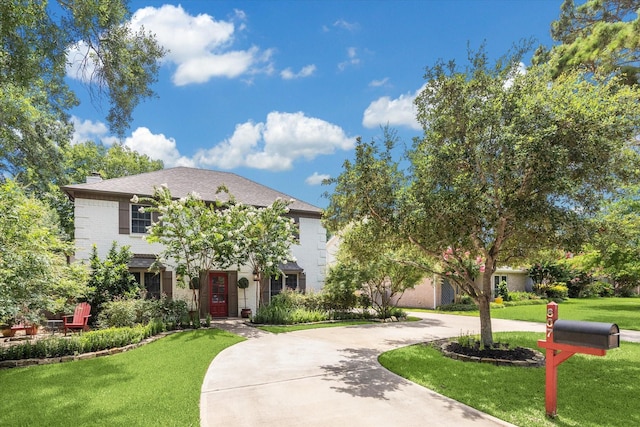 607 Ellingham Dr, Katy, TX 77450 - view of front facade with a front lawn, a chimney, and curved driveway