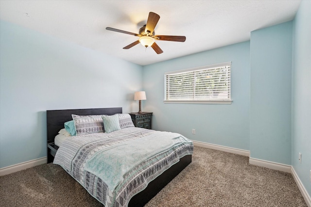 607 Ellingham Dr, Katy, TX 77450 - carpeted bedroom with baseboards and ceiling fan