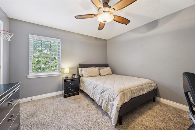 607 Ellingham Dr, Katy, TX 77450 - carpeted bedroom with baseboards and a ceiling fan