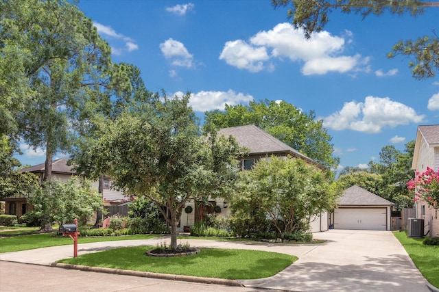 607 Ellingham Dr, Katy, TX 77450 - obstructed view of property featuring curved driveway, a front lawn, and a garage