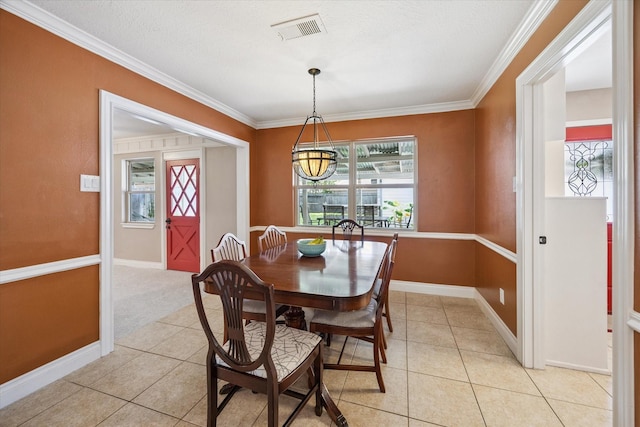 607 Ellingham Dr, Katy, TX 77450 - dining room featuring crown molding and light tile patterned floors
