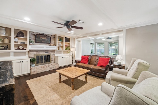607 Ellingham Dr, Katy, TX 77450 - living room with a ceiling fan, dark wood-style floors, a fireplace, crown molding, and recessed lighting