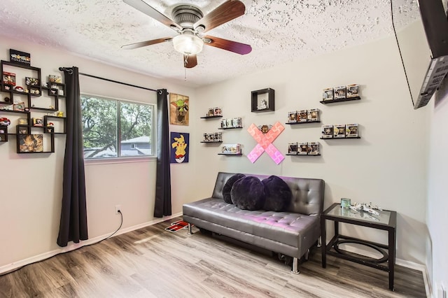 1902 Pepperrell Place Ct, Katy, TX 77493 - sitting room featuring wood finished floors, a ceiling fan, and a textured ceiling