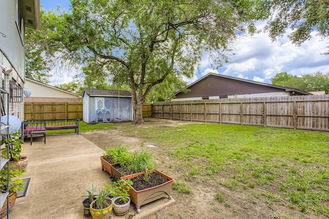 1902 Pepperrell Place Ct, Katy, TX 77493 - fenced backyard with a shed, a vegetable garden, and a patio area
