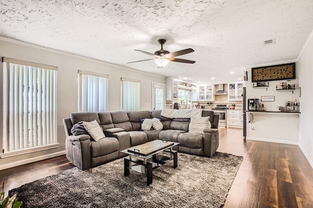 1902 Pepperrell Place Ct, Katy, TX 77493 - living room featuring crown molding, ceiling fan, dark wood-style floors, a textured ceiling, and recessed lighting