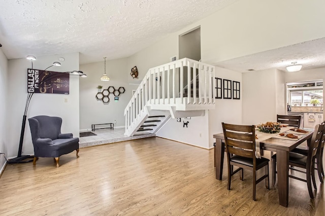1902 Pepperrell Place Ct, Katy, TX 77493 - dining space with a textured ceiling, stairs, and wood finished floors