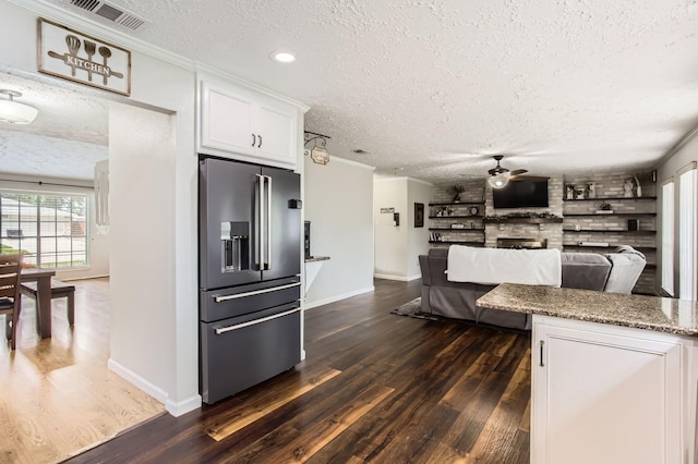 1902 Pepperrell Place Ct, Katy, TX 77493 - kitchen with high quality fridge, a textured ceiling, ceiling fan, dark wood-style flooring, and white cabinetry