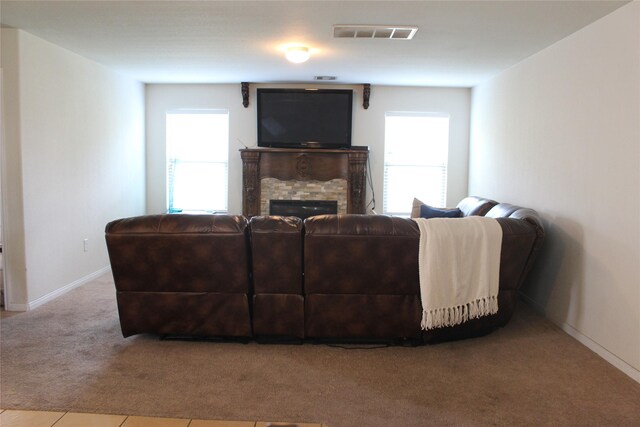 9914 Waldens Pond Ct, Houston, TX 77044 - carpeted living area with healthy amount of natural light and a fireplace