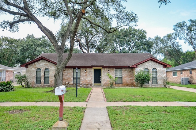 22127 Kerryblue Dr, Katy, TX 77450 - view of front of property with a front yard, a shingled roof, and brick siding
