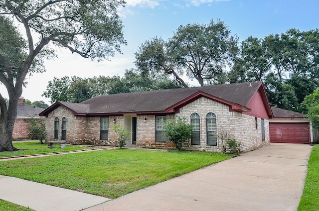 22127 Kerryblue Dr, Katy, TX 77450 - view of front of home featuring a front lawn, a detached garage, brick siding, and an outdoor structure