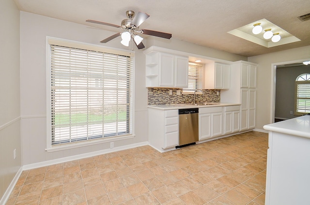 22127 Kerryblue Dr, Katy, TX 77450 - kitchen with stainless steel dishwasher, light countertops, and white cabinets
