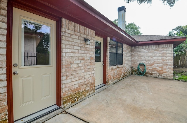 22127 Kerryblue Dr, Katy, TX 77450 - entrance to property featuring brick siding, a patio, and roof with shingles