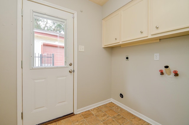 22127 Kerryblue Dr, Katy, TX 77450 - laundry room featuring hookup for an electric dryer and cabinet space