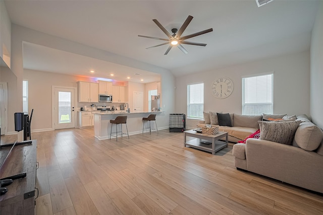 3213 Overfalls Dr, Santa Fe, TX 77510 - living area featuring a ceiling fan, light wood-type flooring, and recessed lighting