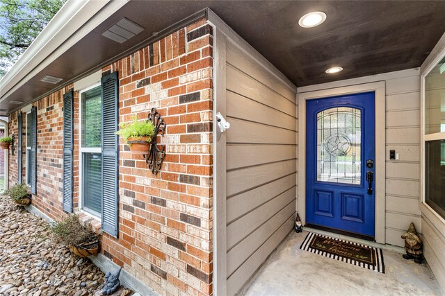 112 April Wind Dr E, Montgomery, TX 77356 - view of exterior entry with brick siding