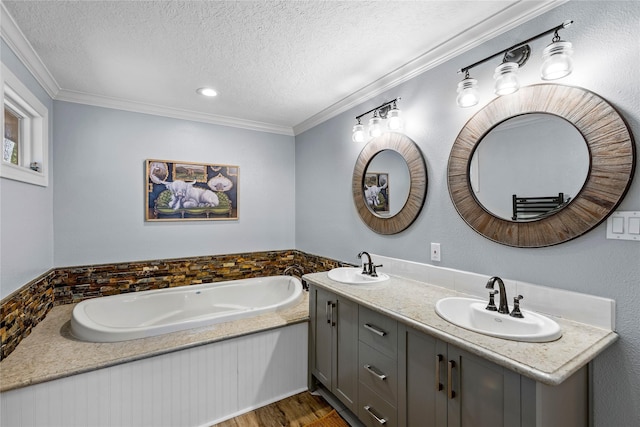 112 April Wind Dr E, Montgomery, TX 77356 - bathroom with a garden tub, double vanity, a textured ceiling, wood finished floors, and ornamental molding