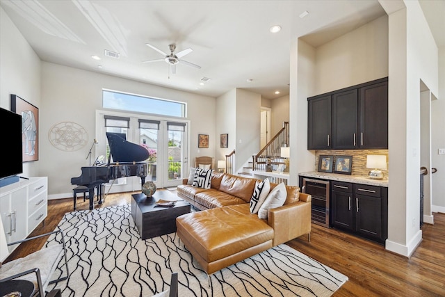 4102 Marina St, Houston, TX 77007 - living room with beverage cooler, stairs, wood finished floors, and recessed lighting