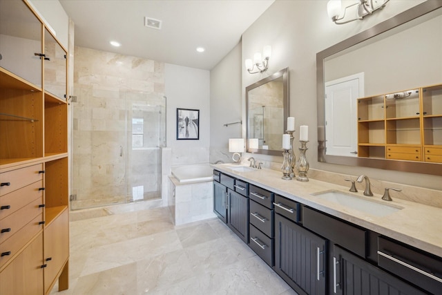 4102 Marina St, Houston, TX 77007 - bathroom featuring a bath, double vanity, a shower stall, marble finish flooring, and recessed lighting