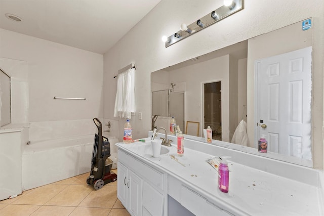 1327 Bartlett Cove Dr, Houston, TX 77067 - full bath featuring vanity, a bath, tile patterned flooring, and a stall shower