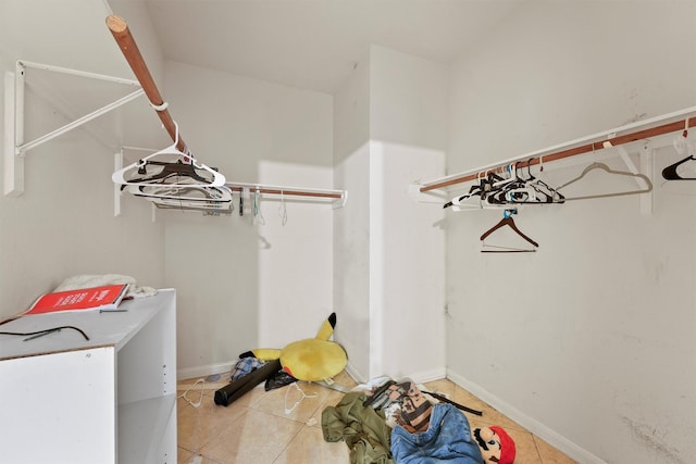 1327 Bartlett Cove Dr, Houston, TX 77067 - spacious closet featuring light tile patterned floors