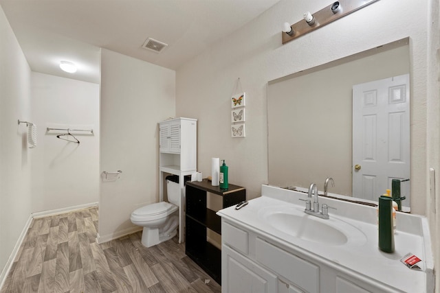 1327 Bartlett Cove Dr, Houston, TX 77067 - bathroom featuring vanity and wood finished floors