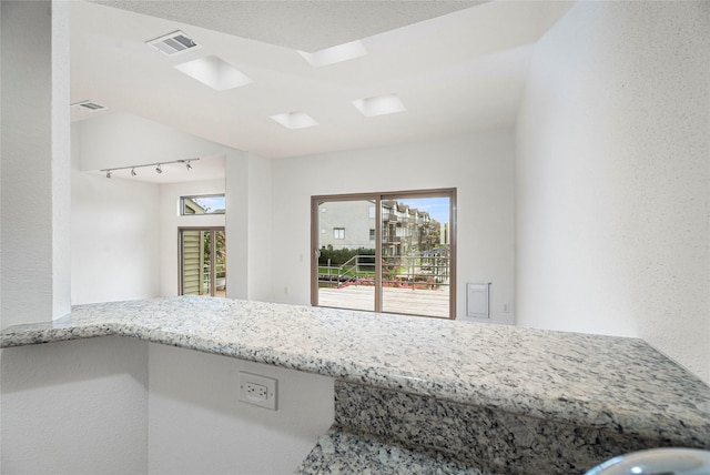 18405 Sandy Cv, Houston, TX 77058 - kitchen featuring light stone counters