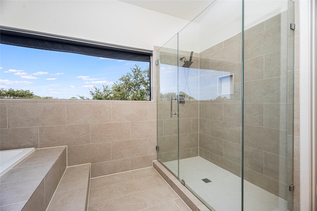 18405 Sandy Cv, Houston, TX 77058 - full bath with a shower stall, a bath, and tile patterned flooring