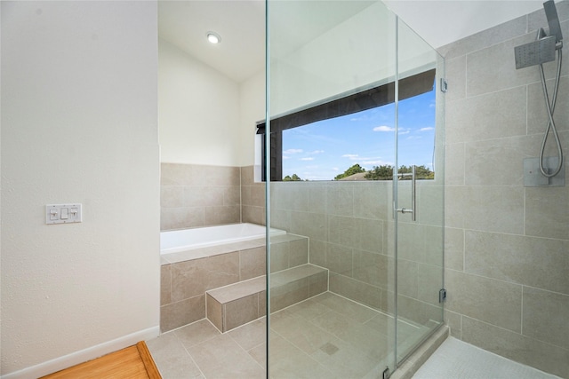 18405 Sandy Cv, Houston, TX 77058 - bathroom featuring a stall shower and a garden tub