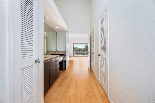 18405 Sandy Cv, Houston, TX 77058 - corridor featuring light wood-style flooring and recessed lighting