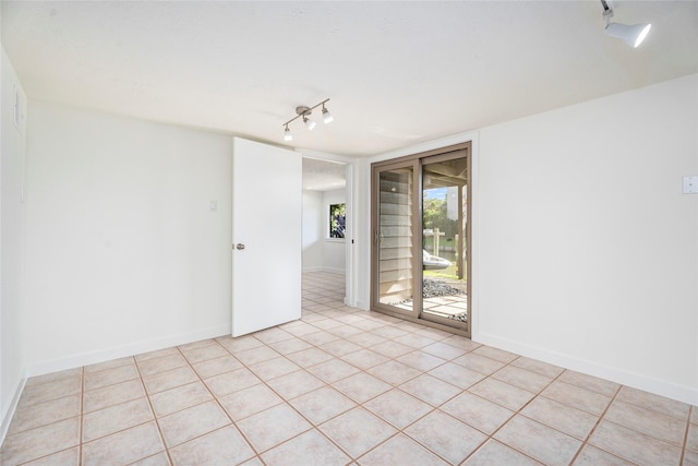 18405 Sandy Cv, Houston, TX 77058 - spare room featuring track lighting and light tile patterned floors