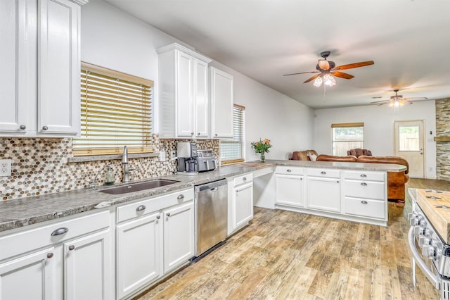 2726 Indigo Stone Ln, Katy, TX 77449 - kitchen with stainless steel dishwasher, a ceiling fan, light wood finished floors, and backsplash