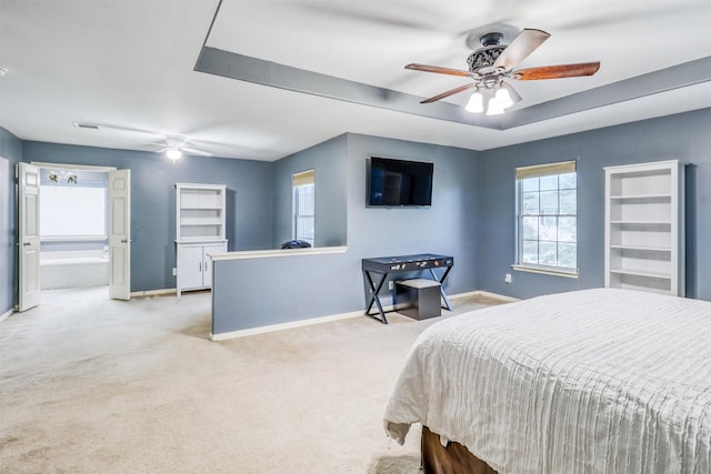 2726 Indigo Stone Ln, Katy, TX 77449 - carpeted bedroom with a raised ceiling and ceiling fan